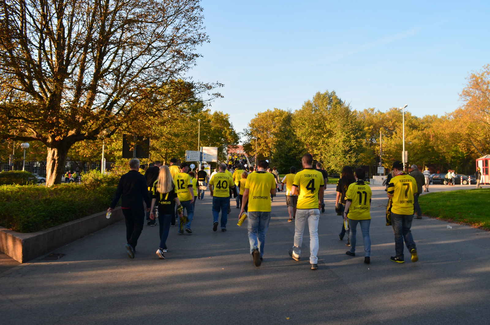 people walking towards the stadium